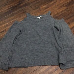 A dark gray long sleeve/sweater
